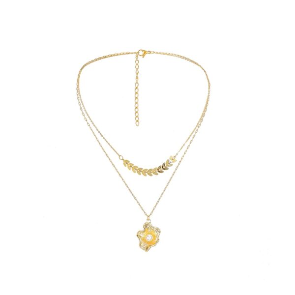 Gold-plated layered necklace with a geometric leaf chain and a shell pendant with pearl accent for a stylish and elegant look.