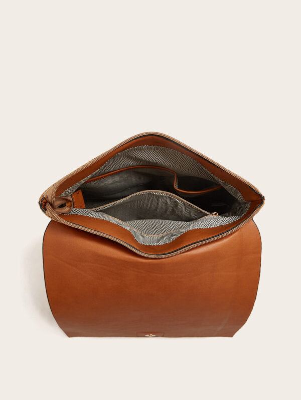 A stylish cork backpack with an elegant honeycomb-inspired vintage design in earthy red, brown, and gold hues.