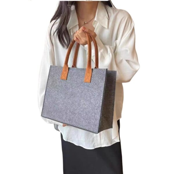 Stylish large capacity felt tote bag in beige, medium gray, and orange with sturdy handles, perfect for shopping and daily use.