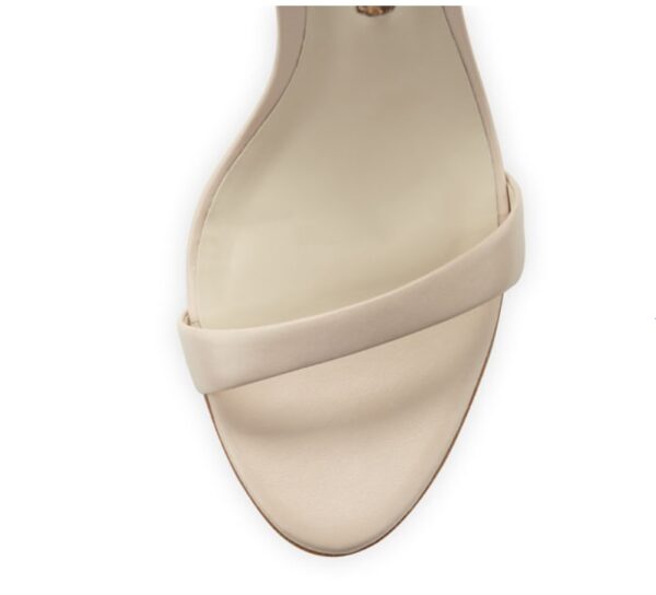A stylish black stiletto heel sandal with a delicate butterfly wing design at the back, featuring an ankle strap and open-toe style.