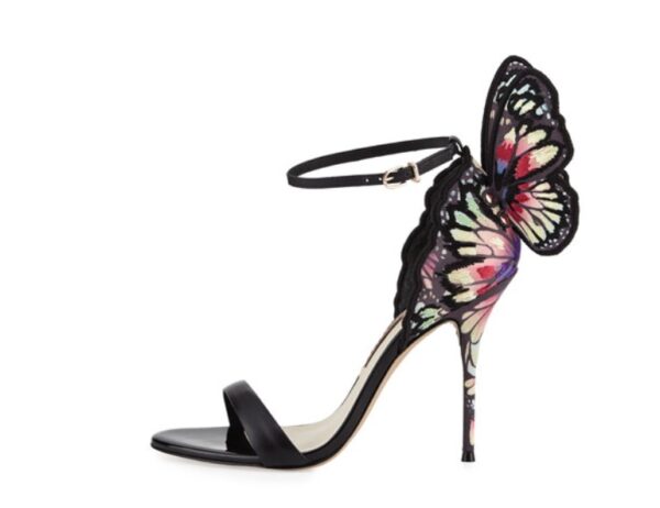 A stylish black stiletto heel sandal with a delicate butterfly wing design at the back, featuring an ankle strap and open-toe style.