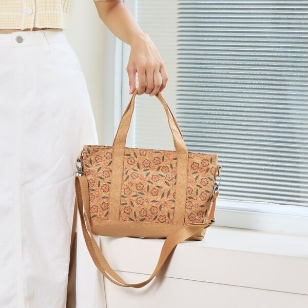 Sustainable cork crossbody bag with an idyllic floral design, featuring an adjustable strap and eco-friendly materials.