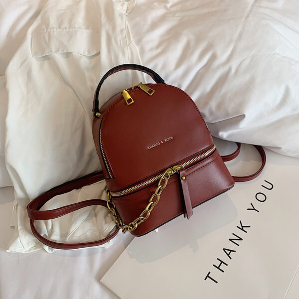 "Mini PU leather backpack with chain accent – women’s stylish travel and school bag"