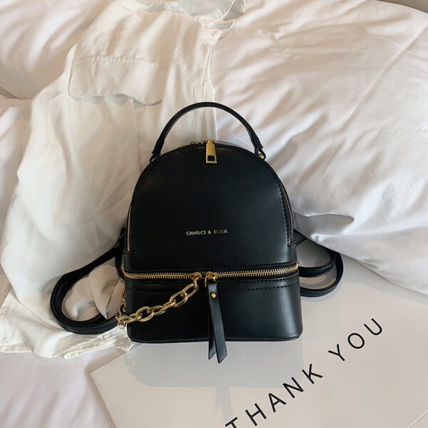 "Mini PU leather backpack with chain accent – women’s stylish travel and school bag"