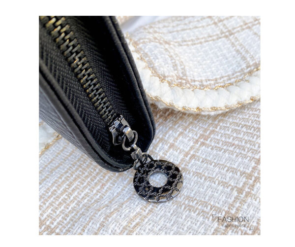 Black gothic skull long wallet for women with multiple card slots and PU leather finish.