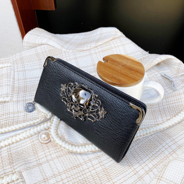 Black gothic skull long wallet for women with multiple card slots and PU leather finish.