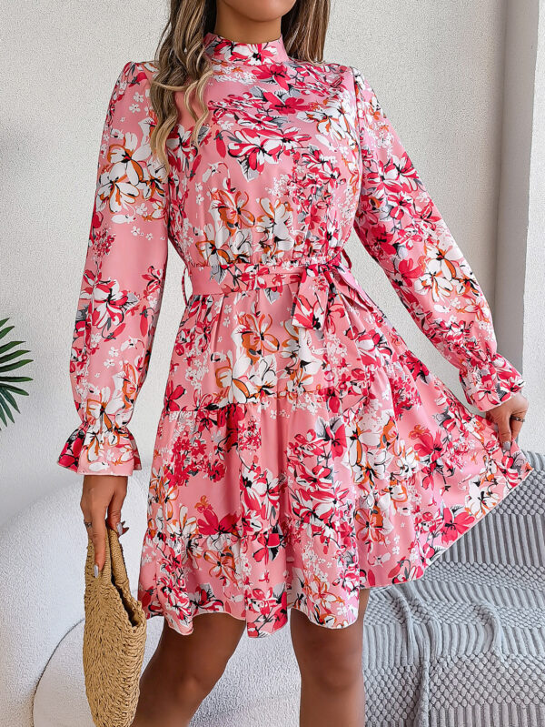 "Multicolor floral ruffle A-line dress with stand collar and waist tie in pink, purple, and navy colors"