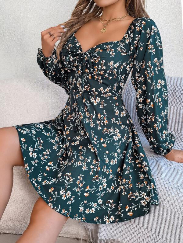 "Multicolor floral mini dress with sweetheart neckline and long puff sleeves in red, green, and navy"