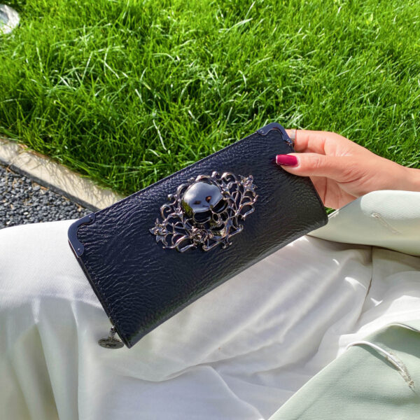Black gothic skull long wallet for women with multiple card slots and PU leather finish.