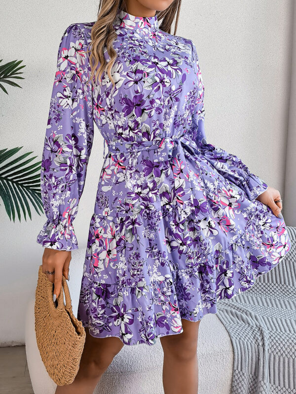 "Multicolor floral ruffle A-line dress with stand collar and waist tie in pink, purple, and navy colors"
