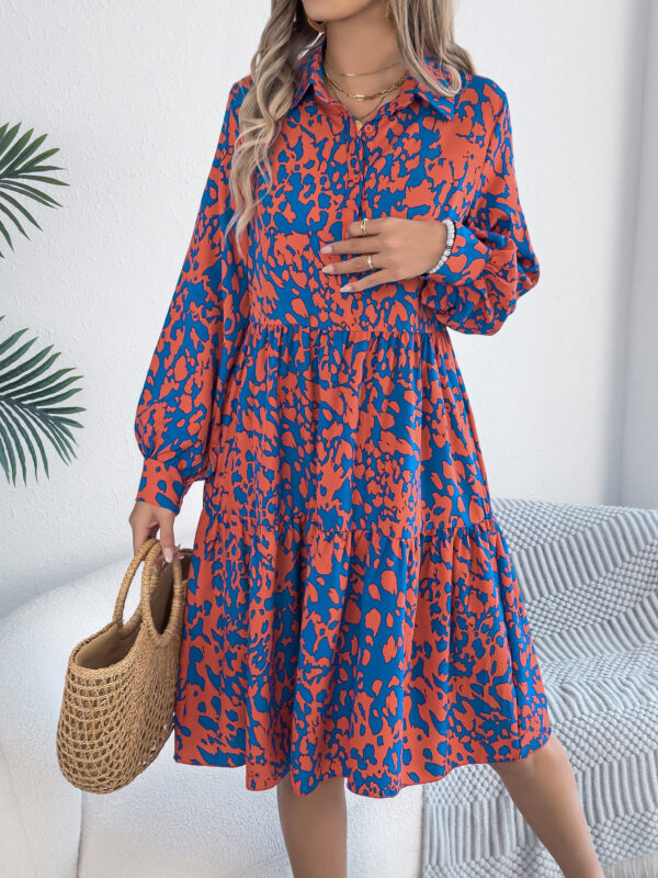 Woman in bold red and blue contrast color leopard print long-sleeved dress